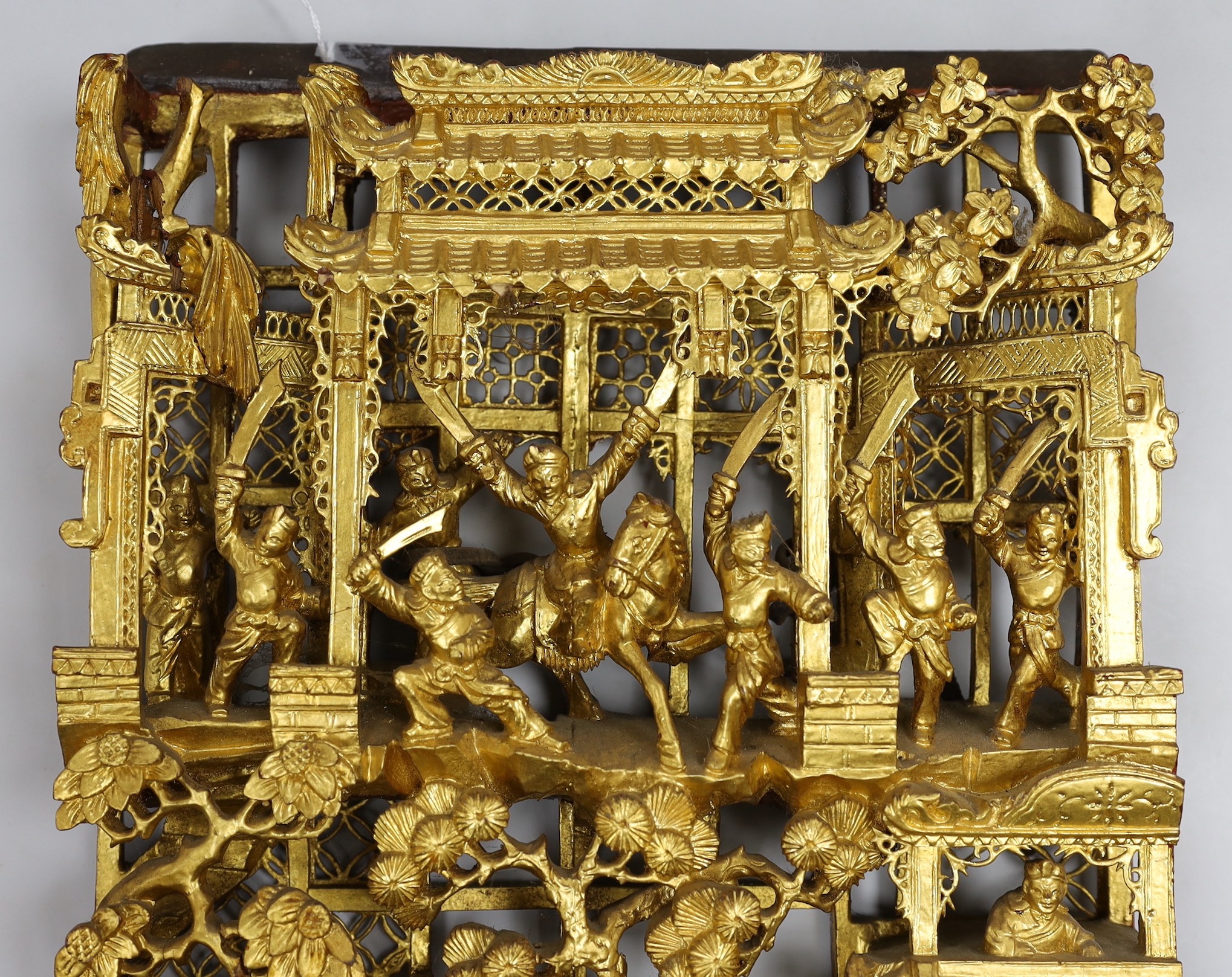 A Chinese gilt carved figural relief, 25cms wide, 54cms high